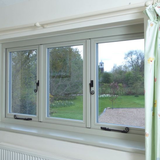 Wooden casement window with Monkeytail handle