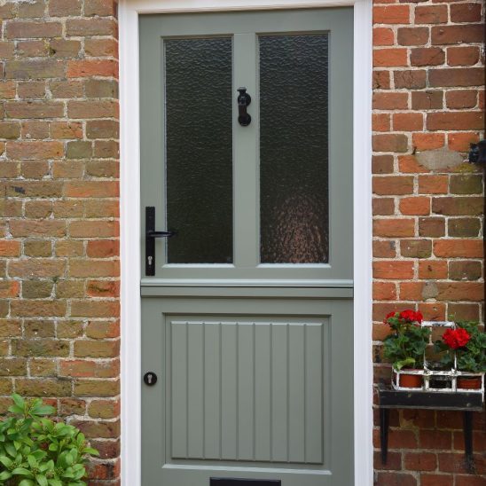 Timber stable door in Tent Grey with Matt Black handle, knocker and letterbox