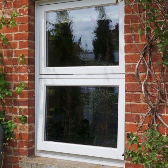Double opening timber casement window in white