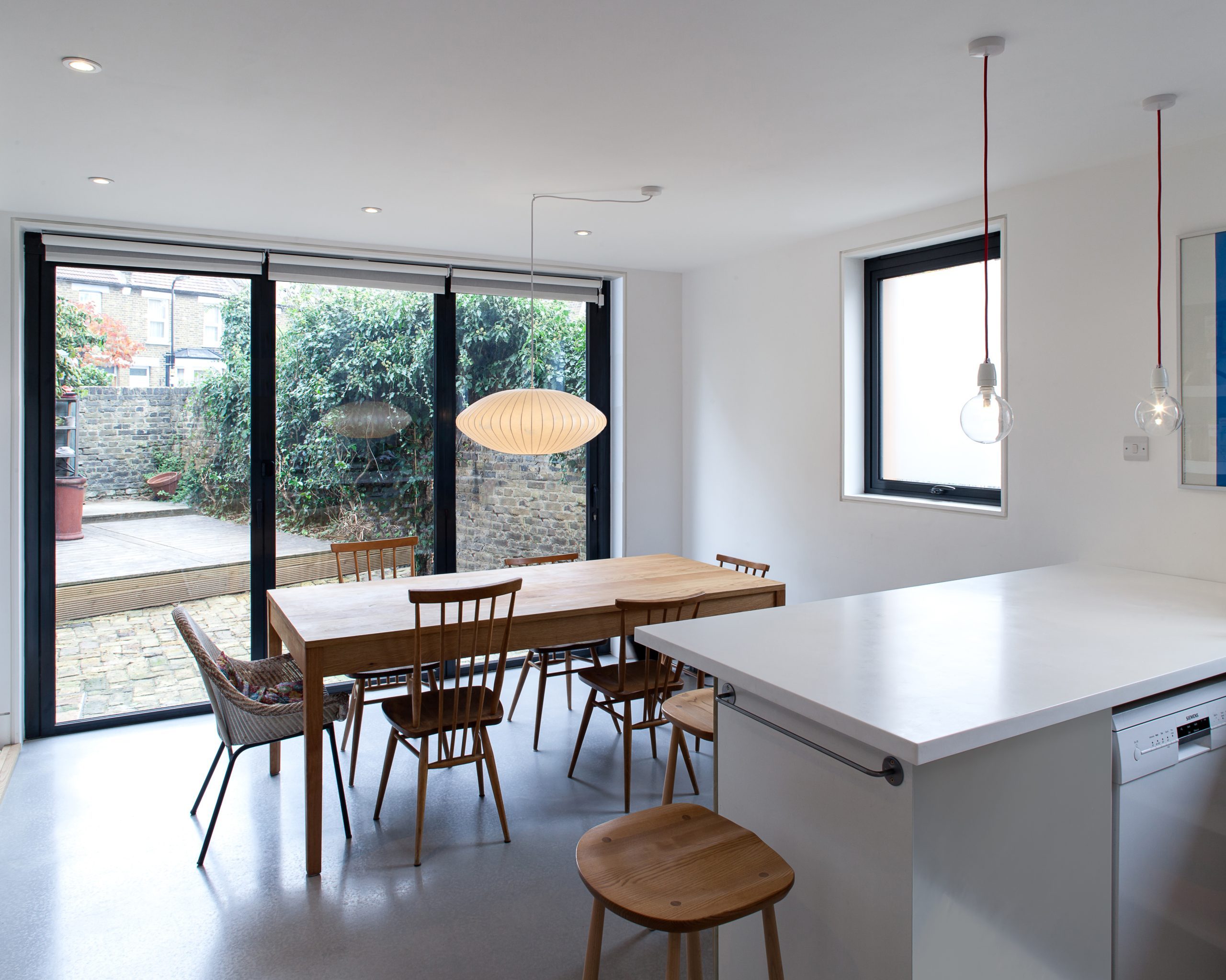 Sunflex bifold door in a dining room setting and patio views