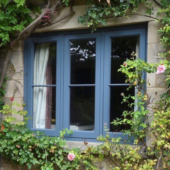 Timber blue casement windows with 18mm horizontal astragal bar