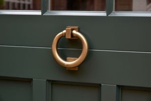 Antique brass unlacquered ring knocker by Samuel Heath