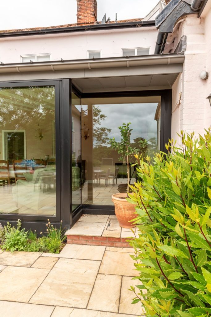 Sunflex aluminium full length fixed pane windows, designed around the well