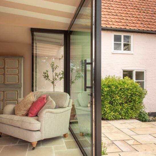 Sunflex sliding patio doors with staibnless steel bar handle on the inside and flush handle on the outside