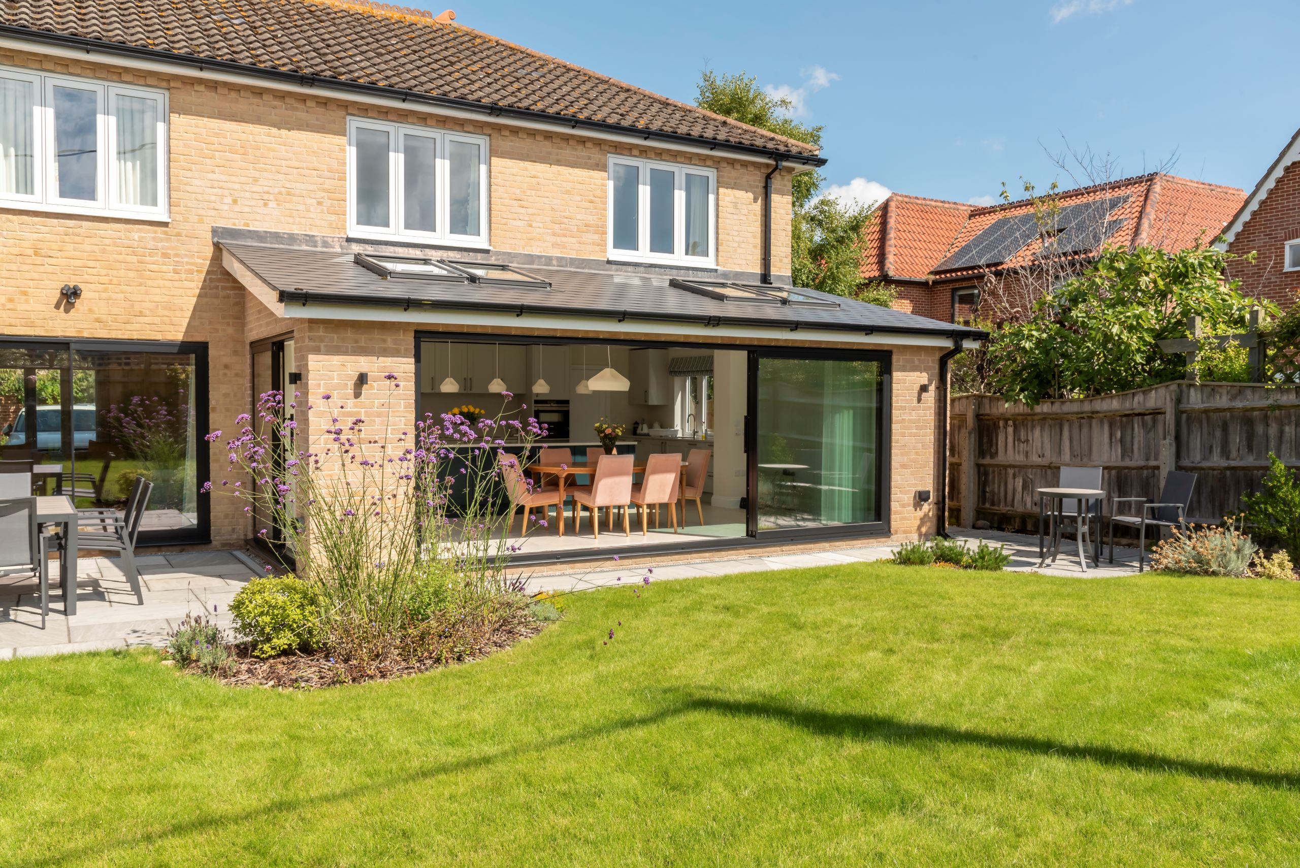 Sunflex black SVG20 aluminium ultra slim sliding doors at Aldeburgh home - open.