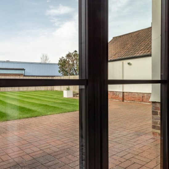 Steel look aluminium French doors with 20mm astragal bars