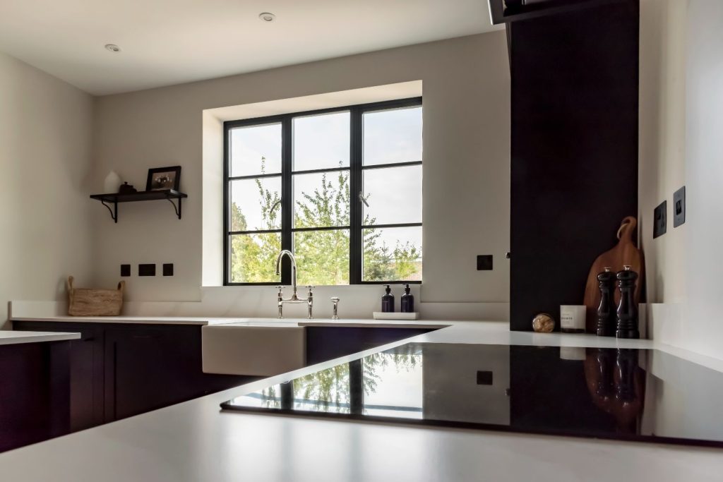 Steel look aluminium windows in black with astragal bars