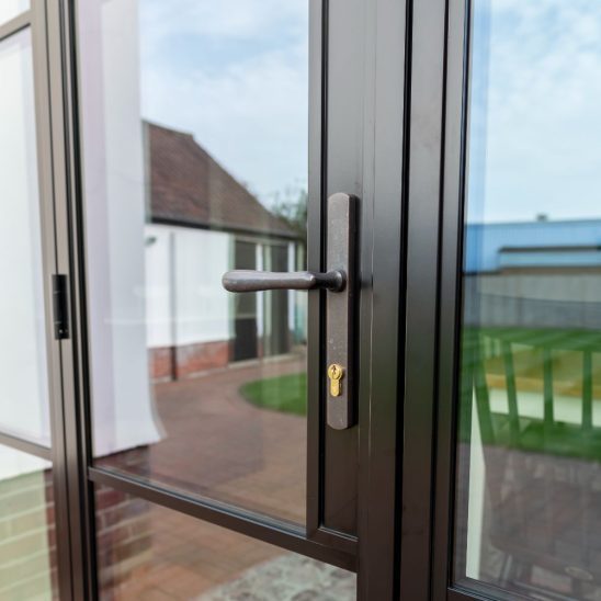 Steel look aluminium French door handle. Aluco at The Burgess Group
