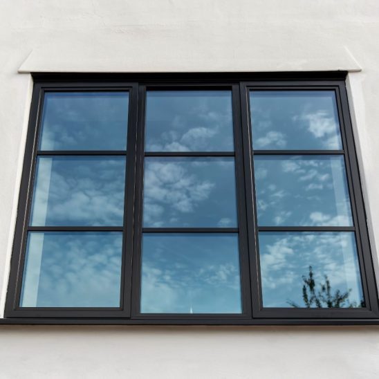 Steel look aluminium windows in black with astragal bars