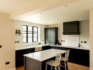 Steel look aluminium windows in black with astragal bars