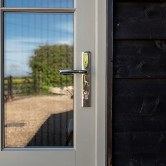 Bardwell redwood engineered front door in French grey with a polished nickel newbury handle