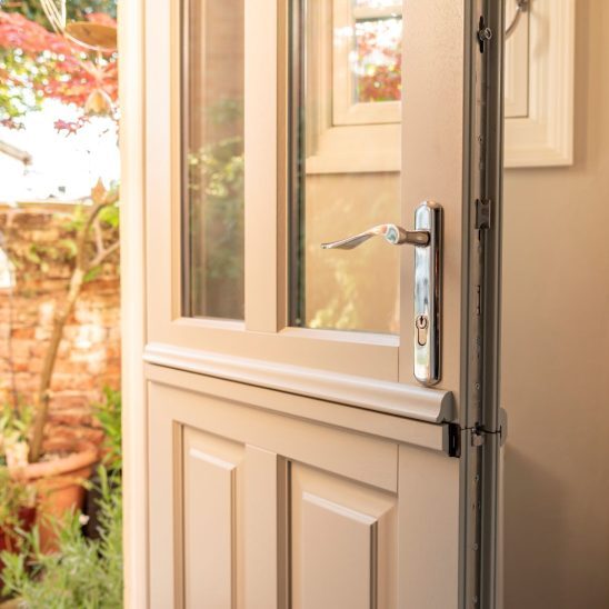 Timber Kingston stable door in French Grey with Regent 316 handle