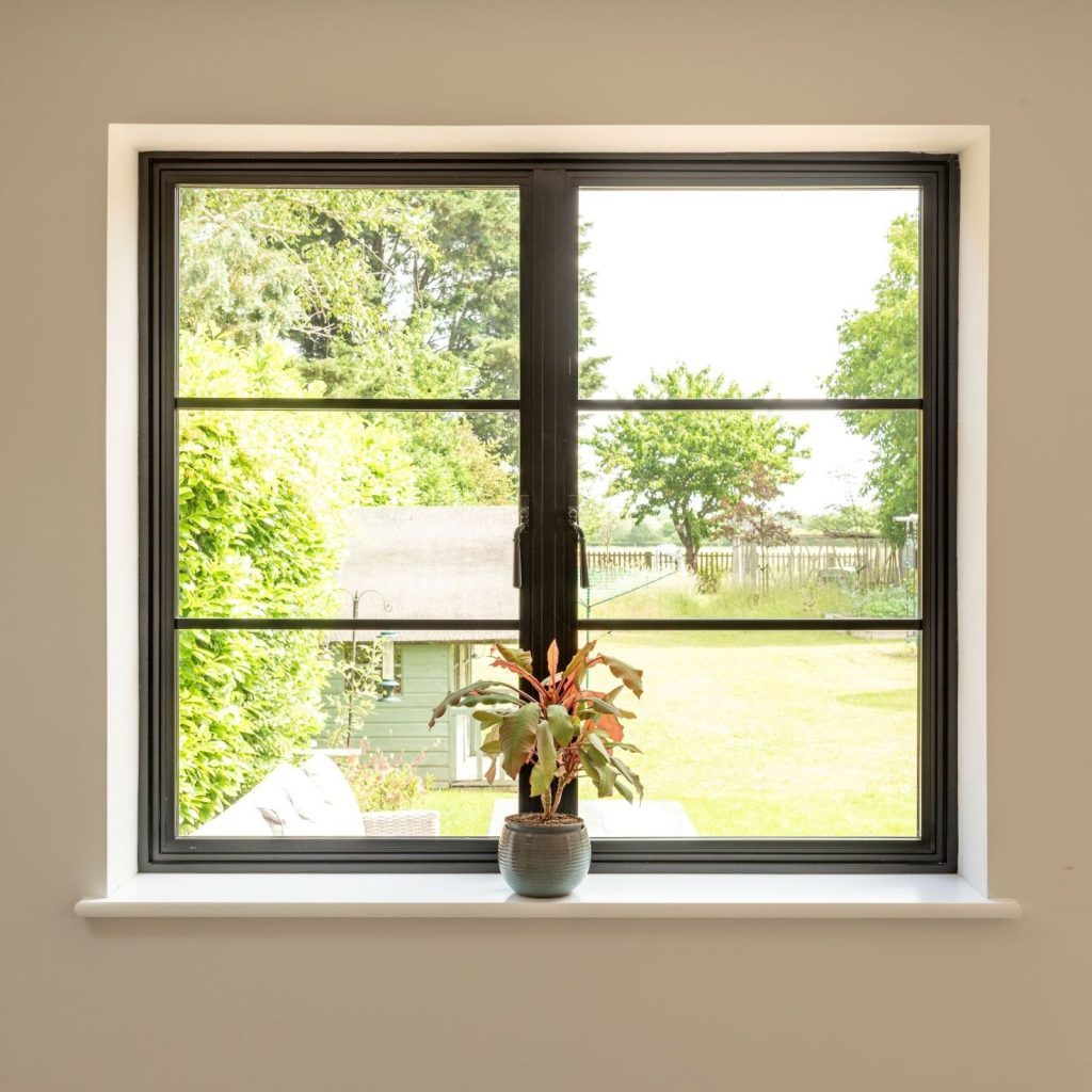 Aluco aluminium steel look window with super slim glazing bars in matt Black with Newbury handle