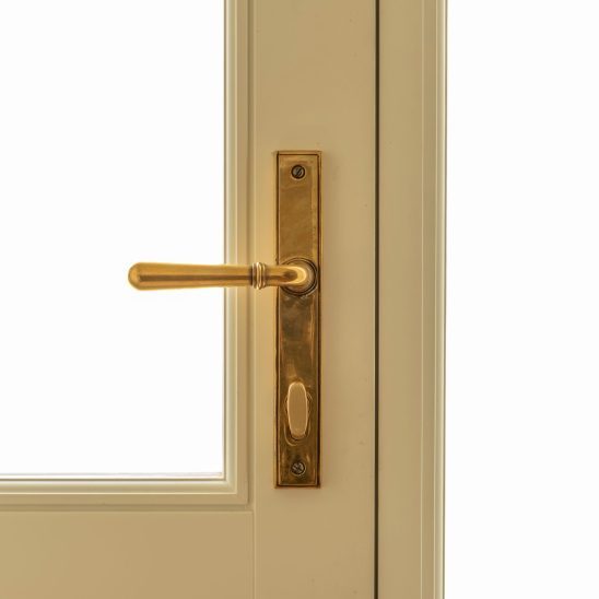 Newbury aged brass door handle on our engineered timber 'Kingston' door in white
