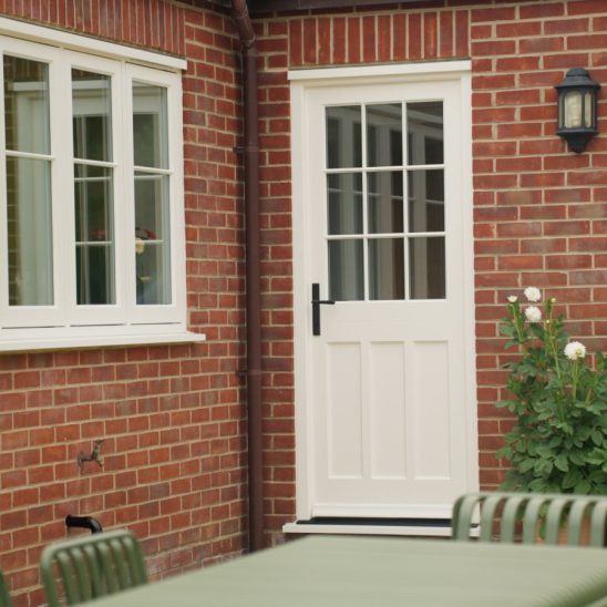 Engineered timber back door and casement windows with 18mm glazing bars in white