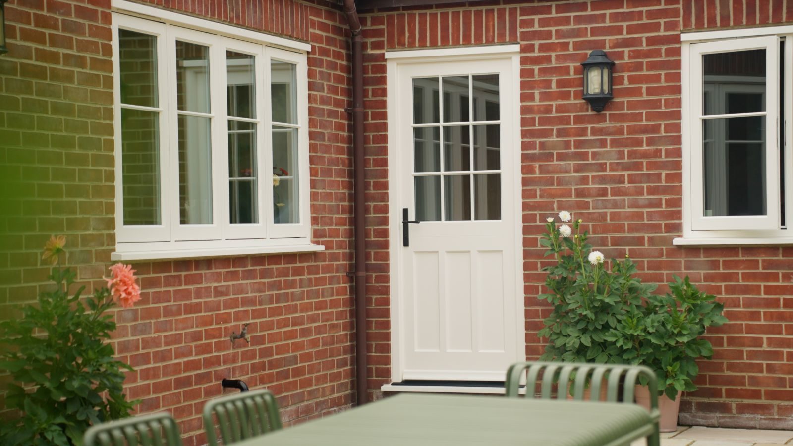 Engineered timber back door and casement windows with 18mm glazing bars in white