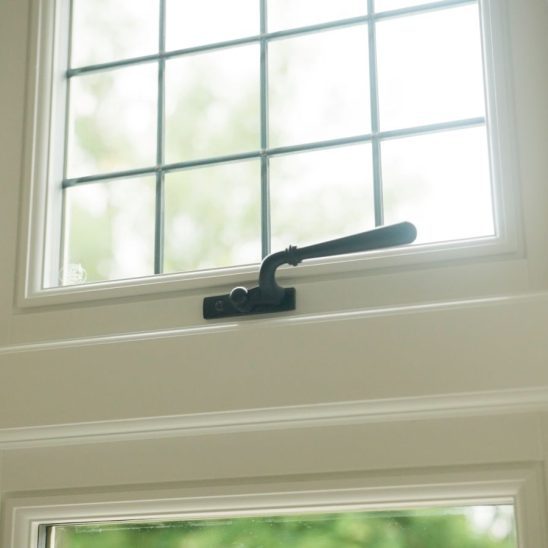 White engineered timber casement window with leaded lights
