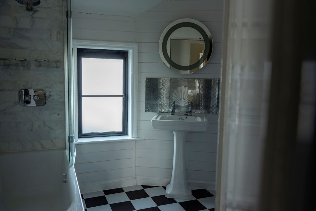 Black heritage, Art Deco aluminium bathroom window with obscured glass and super slim glazing bars