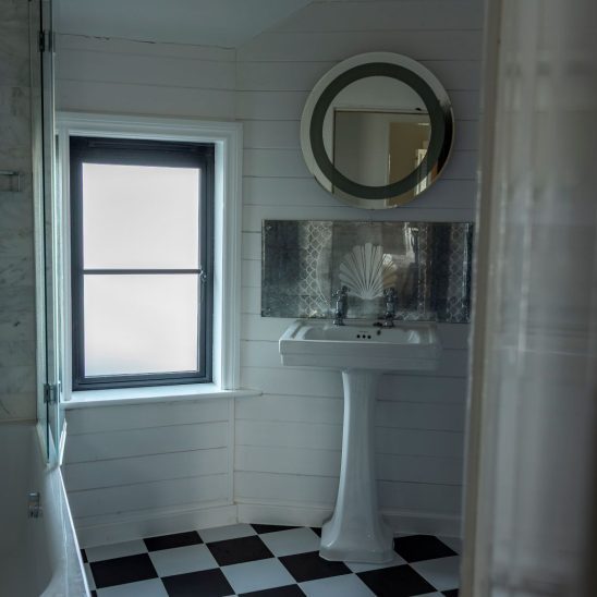Black heritage, Art Deco aluminium bathroom window with obscured glass and super slim glazing bars