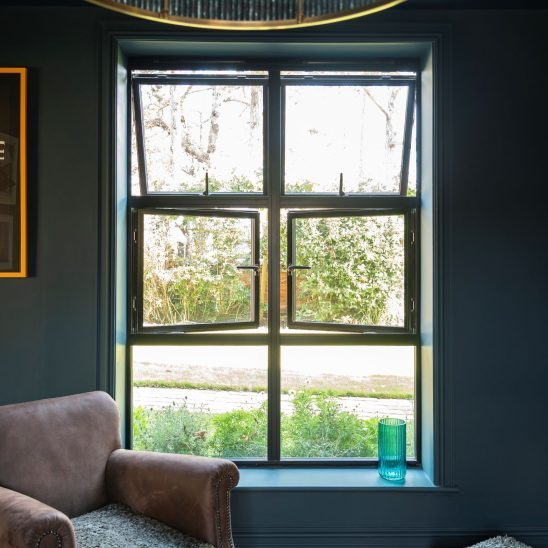 Black heritage, Art Deco aluminium windows with super slim glazing bars and a mix of top and side openings
