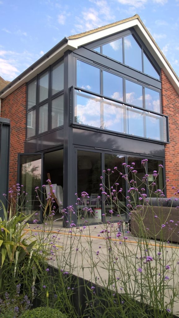 bifold doors with traffic door open to show convenience